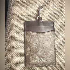 Authentic Coach ID holder/ lanyard. Signature canvas brown and tan w/ gold. New